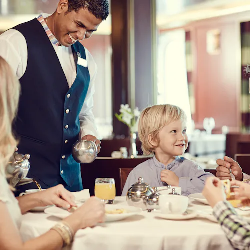 A family enjoying a meal on a P&O Cruises ship